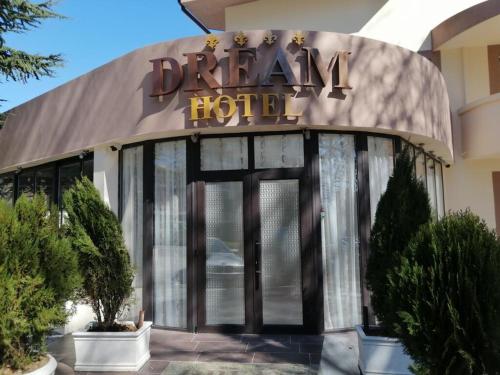 a hotel entrance with a sign that reads drink hotel at Hotel Dream in Stara Zagora