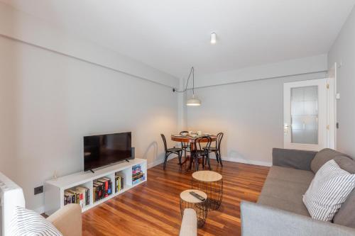 a living room with a couch and a table at Agirre - BasKey rentals in Lekeitio