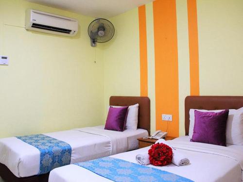 Un ou plusieurs lits dans un hébergement de l'établissement Sun Inns Hotel Cheras - Balakong