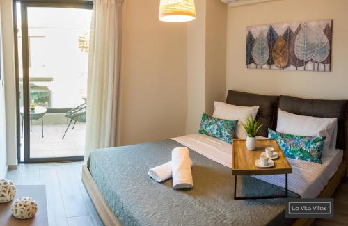 Postel nebo postele na pokoji v ubytování La Vita Villas