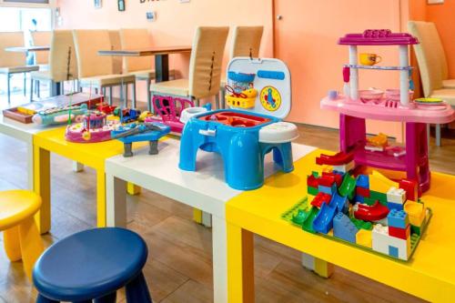 a classroom with two tables with toys on them at An Ti Li Ya Homestay in Dongshan
