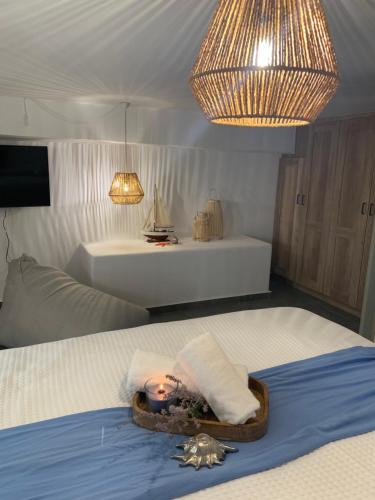 a room with a bed with a doll laying on it at Chrisantakis appartments in Drios
