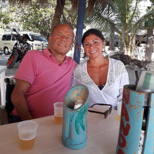 a man and a woman sitting at a table at Haus am Wasserfall in Mellau