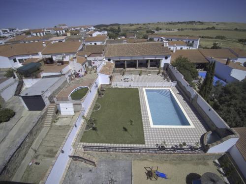 an aerial view of a house with a swimming pool at LA CASONA DE MANUELA in San Benito de la Contienda