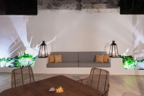 a living room with a couch and a table at PALAZZO FRANGIPANE in Salve