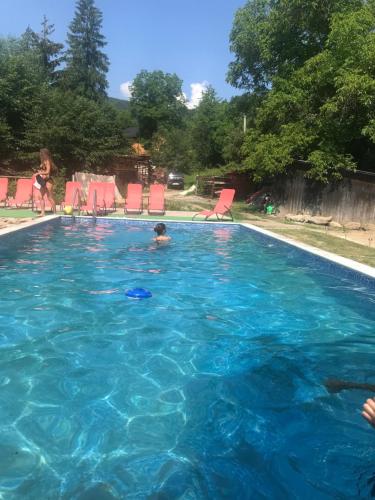 a child swimming in a swimming pool at Hovanka in Yaremche