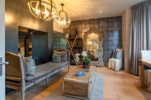 a living room with a couch and a table at No33 HUNSTANTON BOUTIQUE ROOMS in Hunstanton