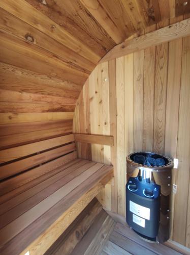 a inside of a wooden sauna with a trash can at Dimora Assuntina Martano in Martano