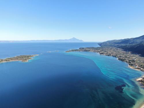 an aerial view of the islands in the ocean at The Palms novasithonia in Vourvourou