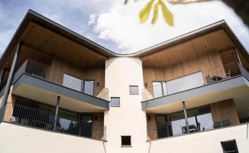 a building with balconies on the side of it at Chalet Insignis in Santa Cristina in Val Gardena