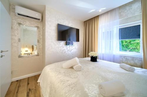 Ένα ή περισσότερα κρεβάτια σε δωμάτιο στο Luxury Apartments JF