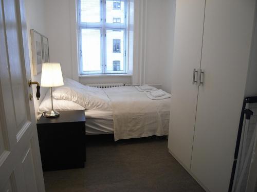 Postel nebo postele na pokoji v ubytování Nørre Farimagsgade