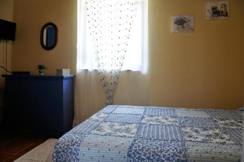 Een bed of bedden in een kamer bij Manfredi Agriturismo