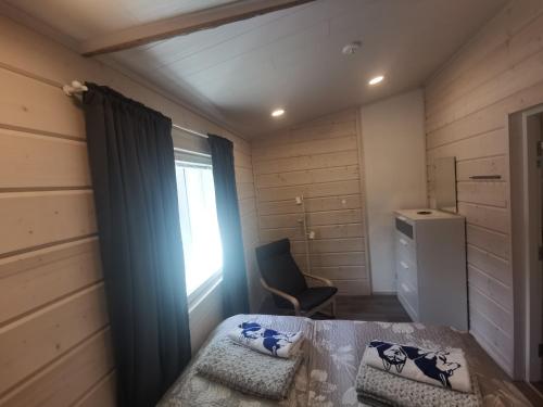 Tempat tidur dalam kamar di Maglelin Experience Lodge