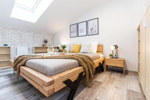 a bedroom with a large bed in a room at KORZO Lipno in Lipno nad Vltavou