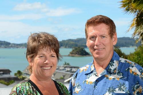a man and a woman standing next to each other at Abri Apartments in Paihia