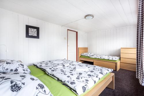 Un pat sau paturi într-o cameră la Chata Anton Günther