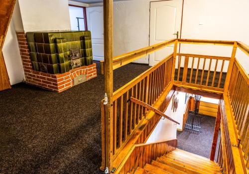 an overhead view of a room with a wooden staircase at Chata Anton Günther in Boží Dar