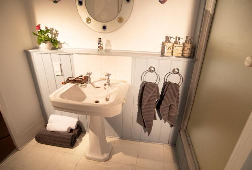 a bathroom with a sink and a mirror at Birch in the Lanes in Brighton & Hove