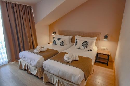 Postel nebo postele na pokoji v ubytování Savaneti Eco Hotel