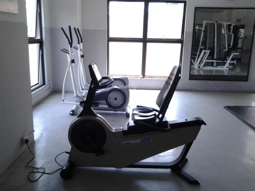 a gym with two computers on a treadmill at Homestay Serviced Apartment - Marina Court in Kota Kinabalu