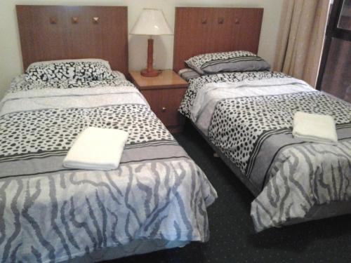 Cama o camas de una habitación en Homestay Serviced Apartment - Marina Court