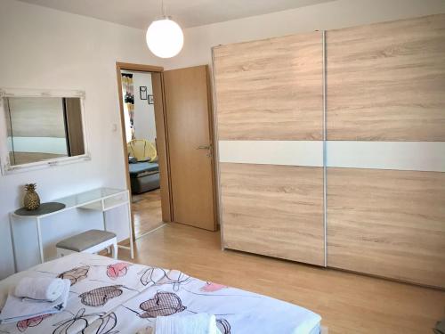 Ein Bett oder Betten in einem Zimmer der Unterkunft Apartment Gabriela