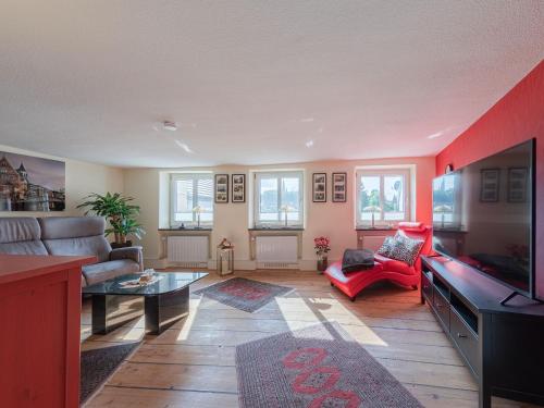 a living room with a couch and a tv at InselGlueck in Herzen Malchows in Malchow