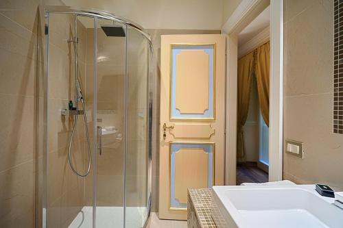 a bathroom with a shower and a sink at Frezza Apartment - Alta Luxury Apartments in Rome