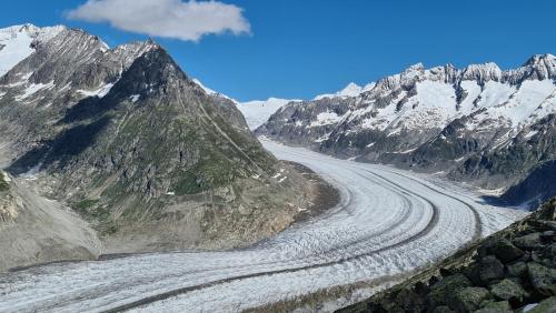 a winding mountain road in the mountains with snow at Bettmeralp Chalet Zendorn in Bettmeralp
