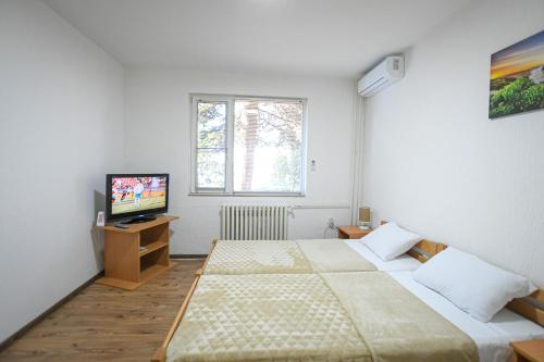 Postel nebo postele na pokoji v ubytování Apartman 59