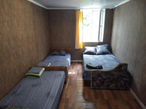 Postel nebo postele na pokoji v ubytování Zontik