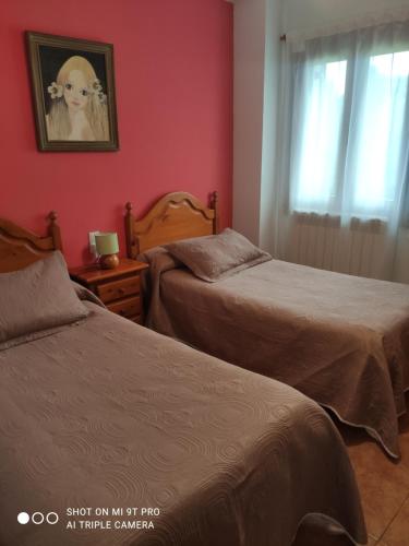 Ένα ή περισσότερα κρεβάτια σε δωμάτιο στο Apartamentos Goizeder