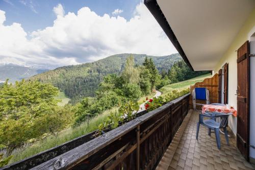 a balcony with a view of the mountains at Grödnerhof Heidi in Brie