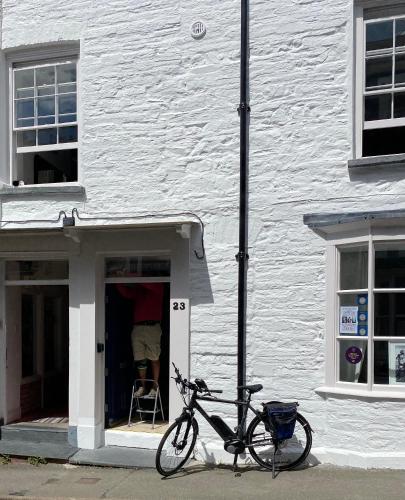 a bike parked in the doorway of a building at The Attic Apartment, Quay Street Studios Cardigan in Cardigan