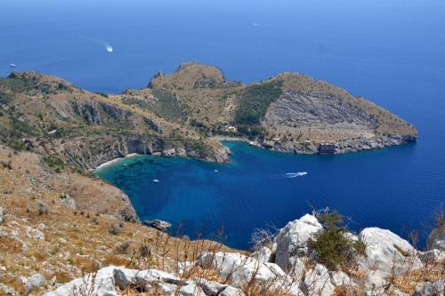 a view of a large blue cove on a mountain at Villa Mariel Suites & Apartment in Massa Lubrense