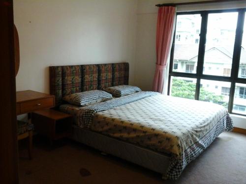 Postel nebo postele na pokoji v ubytování Homestay Serviced Apartment - Marina Court