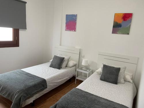 Ένα ή περισσότερα κρεβάτια σε δωμάτιο στο Apartamento las quemadas