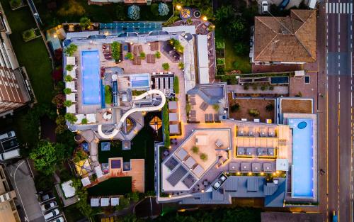 an overhead view of a building with a swimming pool at Hotel Ideal Park in Laives