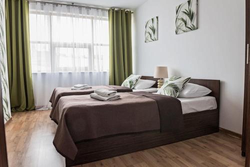 Ένα ή περισσότερα κρεβάτια σε δωμάτιο στο City Aparthotel