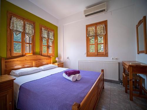 A bed or beds in a room at Olive House in Damouchari with a sea view - Delicious Houses