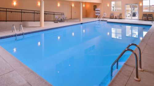 a pool at a hotel with blue water at Holiday Inn Martinsburg, an IHG Hotel in Martinsburg