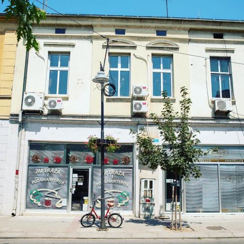 a bike parked in front of a building at Stari Zaječar apartments in Zaječar