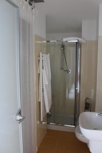 a bathroom with a shower and a toilet and a sink at B&B San Salvo in San Salvo
