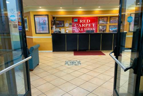 a red carpet restaurant with a red counter in a building at Red Carpet Inn Kinston in Kinston