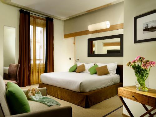 เตียงในห้องที่ Babuino 181 - Small Luxury Hotels of the World