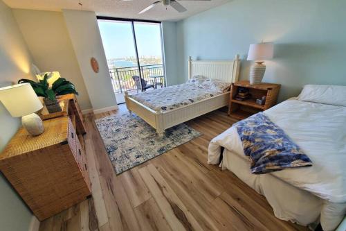 En eller flere senge i et værelse på Sunset Beach oasis: Modern beach style on the sand