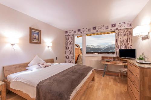 Postel nebo postele na pokoji v ubytování Hotel Ad'Eldorado