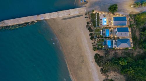 an aerial view of a house on an island in the water at Alas Suites in Alykes
