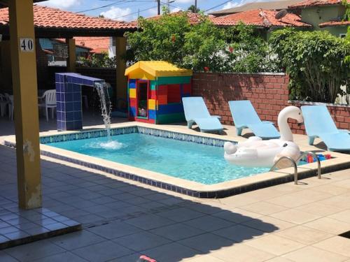 Swimming pool sa o malapit sa Casa em condomínio à beira mar de Porto de Galinhas